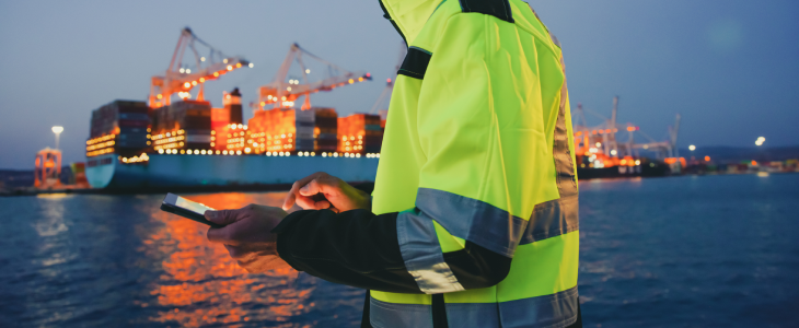 Maritime worker documenting an item