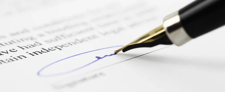 Employee signing a contract with negotiation terms